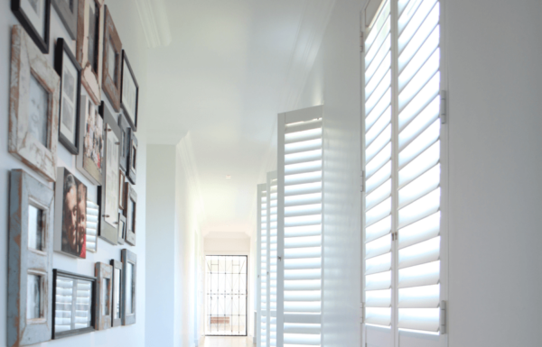 Plantation style security shutters in a hallway