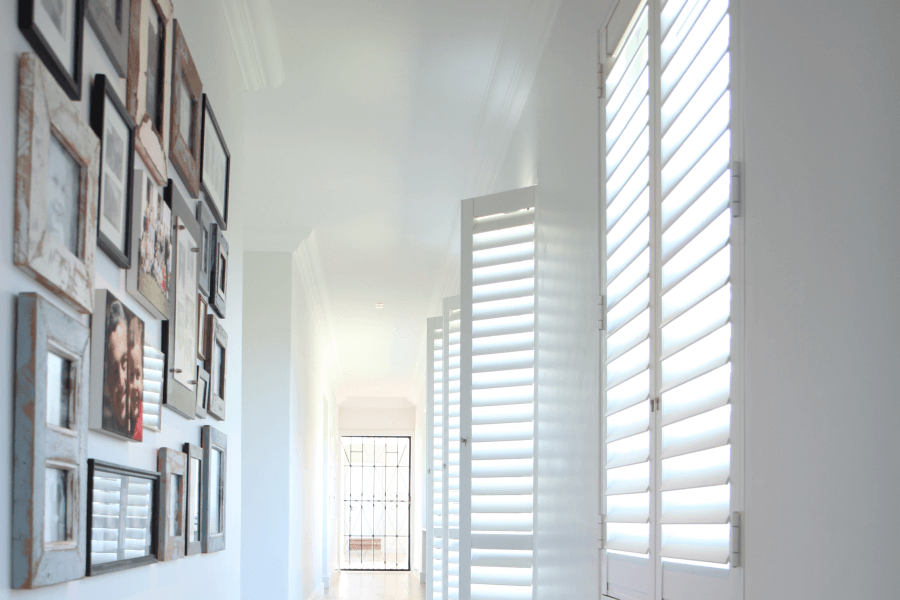 Plantation style security shutters in a hallway