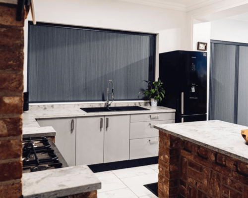 Blackout blind screens installed in a kitchen