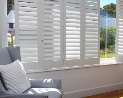 security window shutters professionally installed in a bedroom