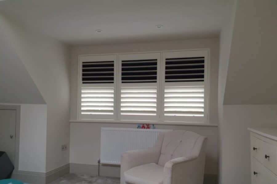 blackout shutters installed in a bedroom to help with sleep